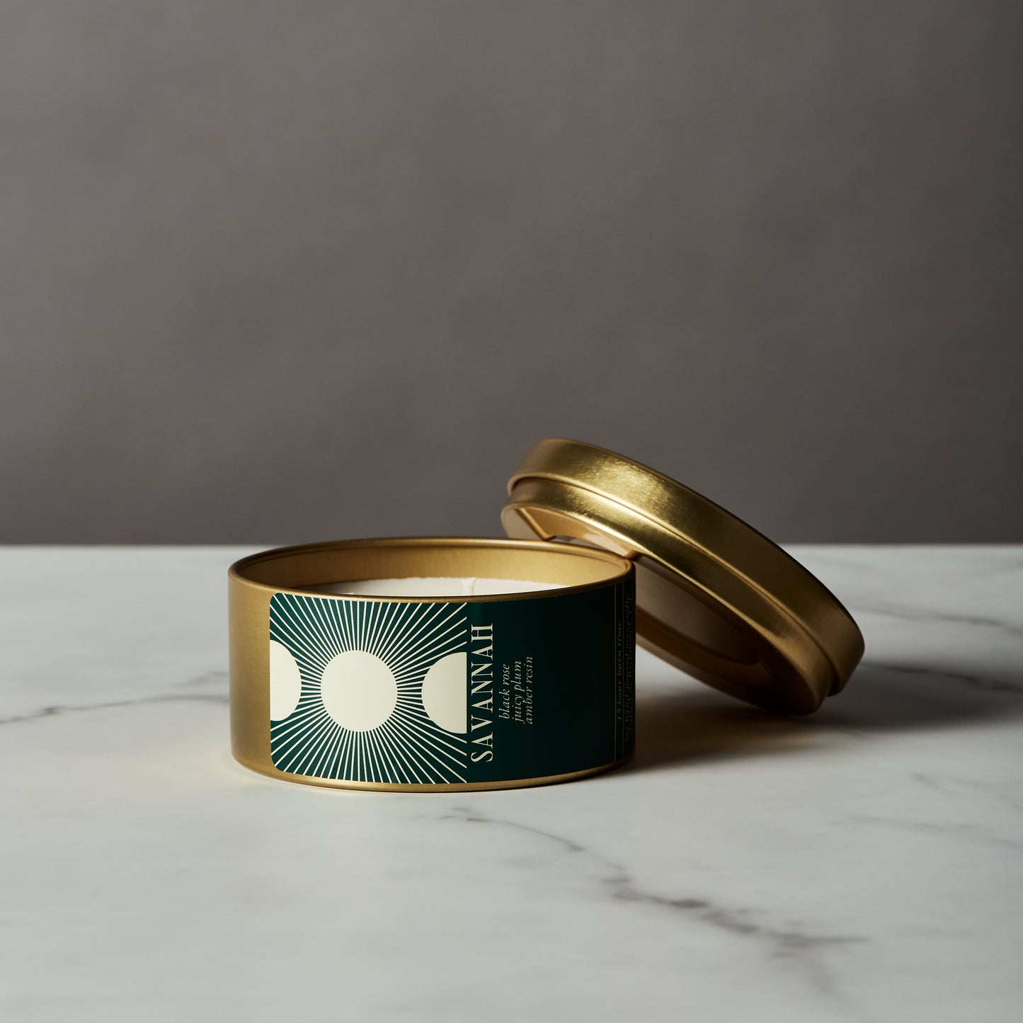 travel candle in modern gold tin