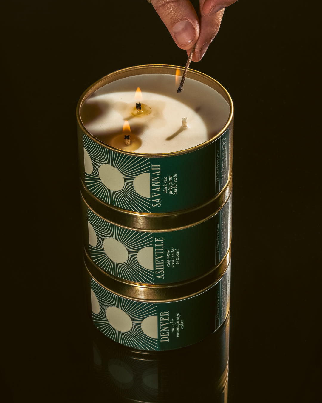 stack of travel candles being lit with  match